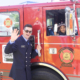 Firefighter Drew Coleman with young Patient on a Saanich Firetruck