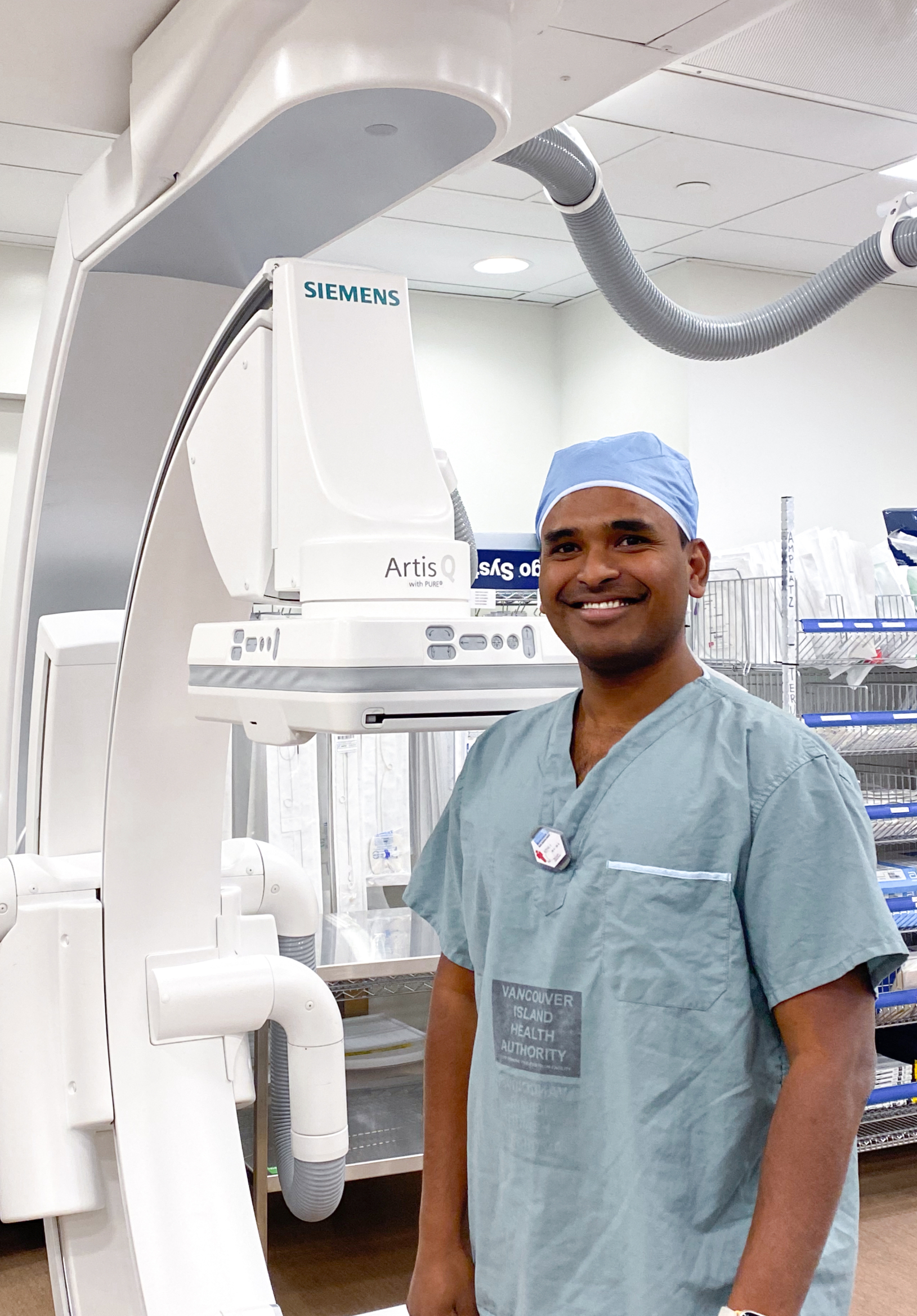 Interventional Radiologist Dr. Vamshi Kotha with a C-Arm Medical Scanner
