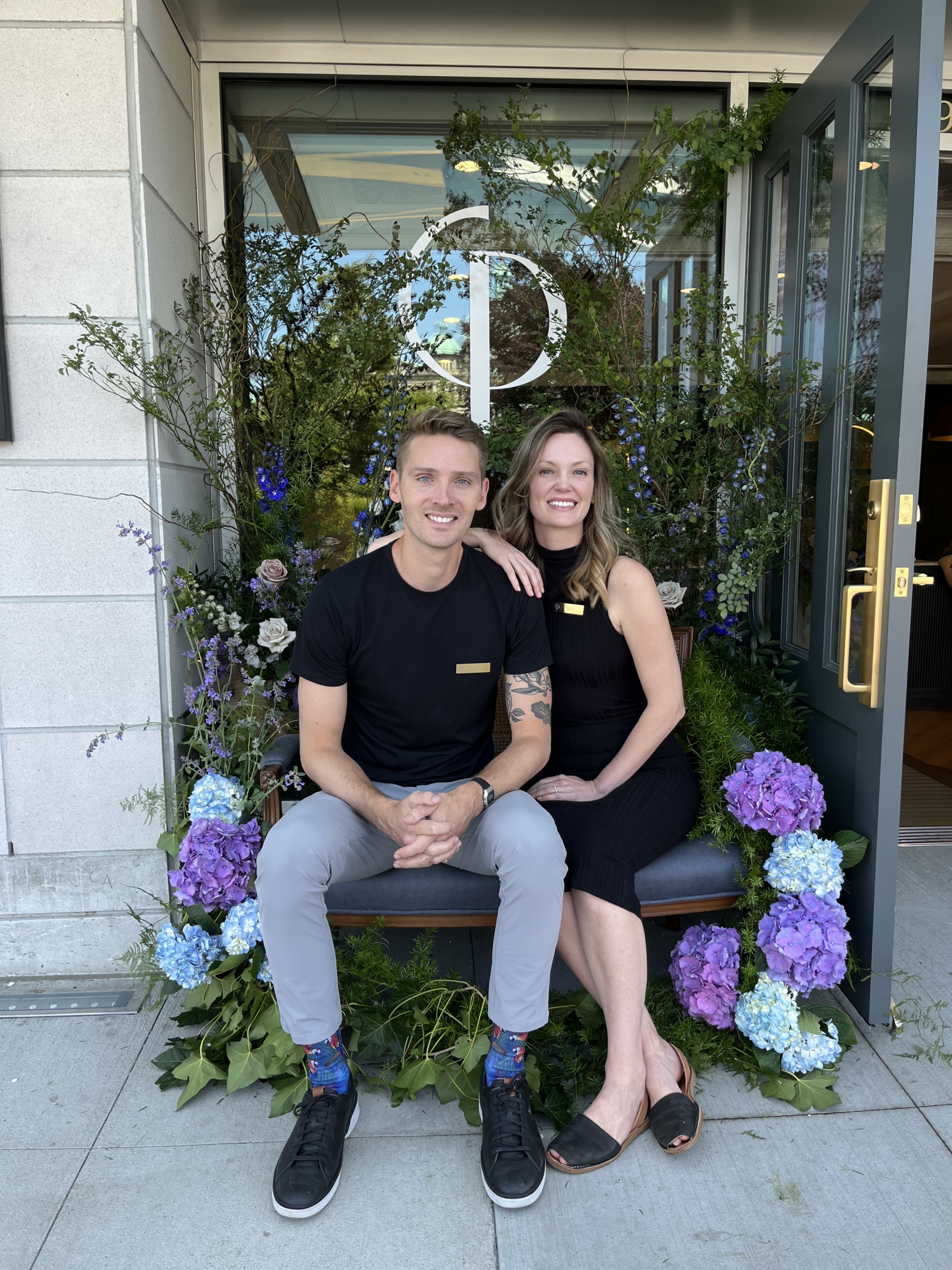 Co-Owners, Dr. Matt & Tara Carere sitting in front of Philosophy MD