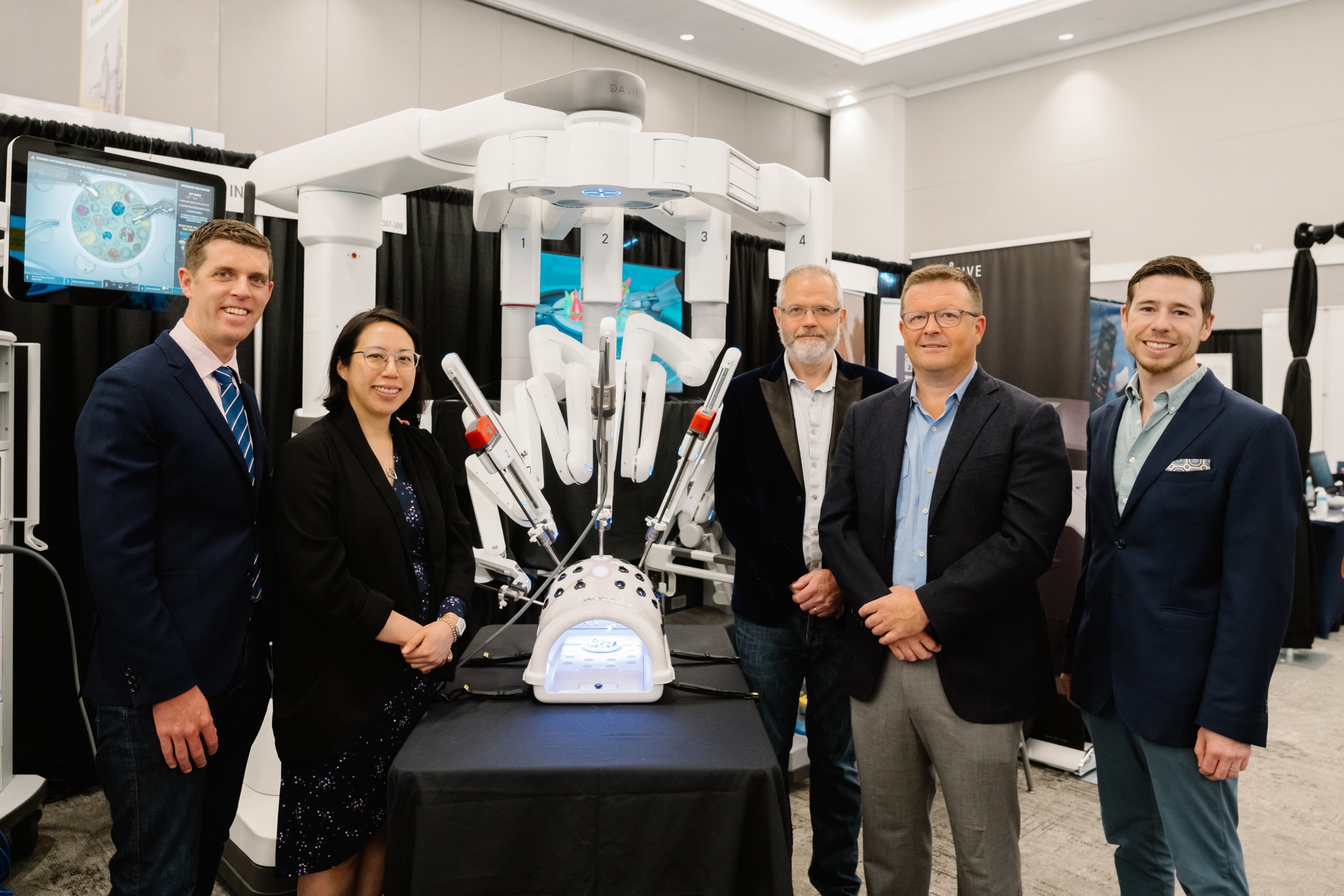 Urologists, Dr. Michael Metcalfe, Dr. Linda Lee, Dr. Iain McAuley, Dr. Jeff McCracken, & Dr. Greg Hosier with the da Vinci Surgical Robot