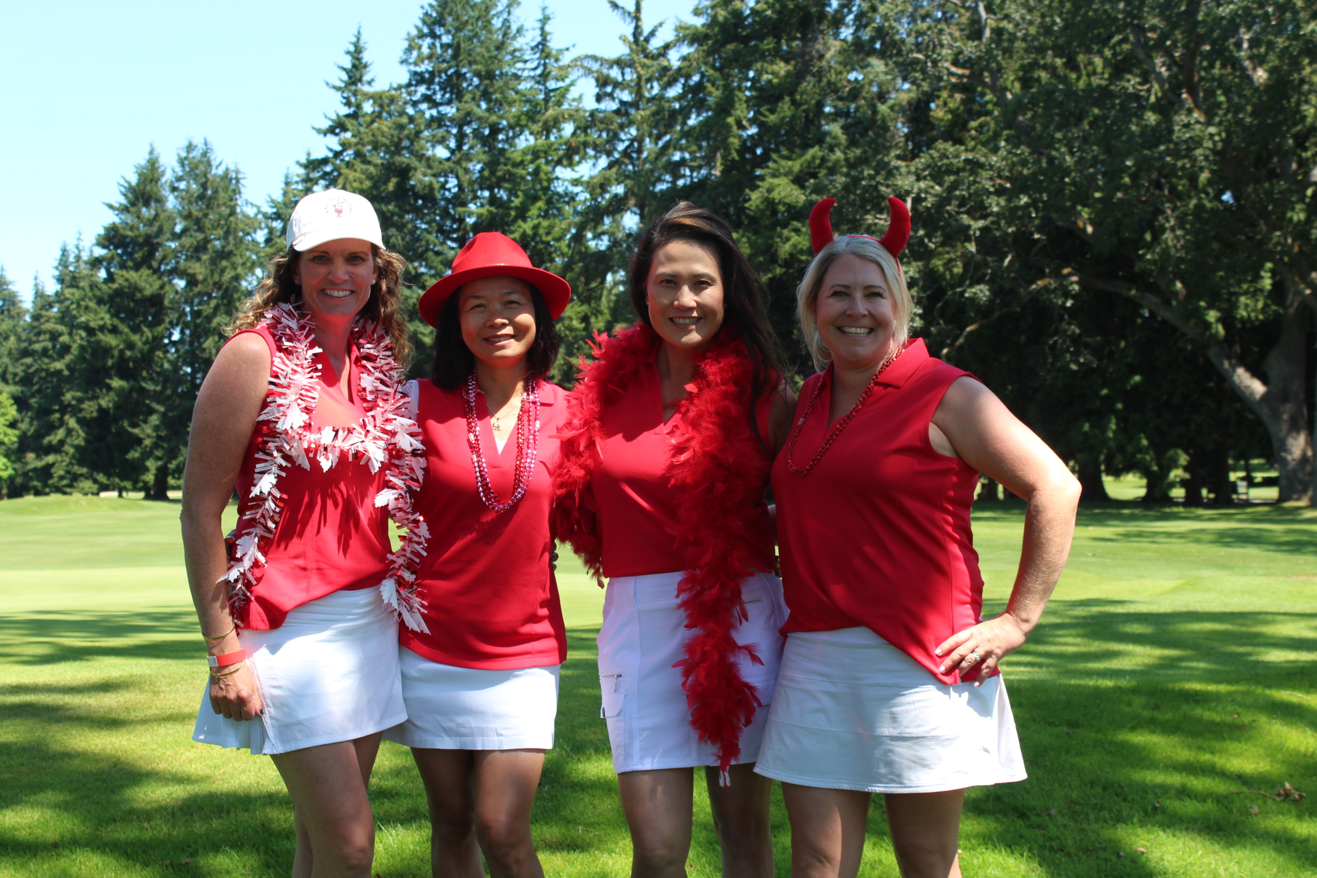 Four Players at the Uplands Golf Club Annual heart Tournament posing for a photo