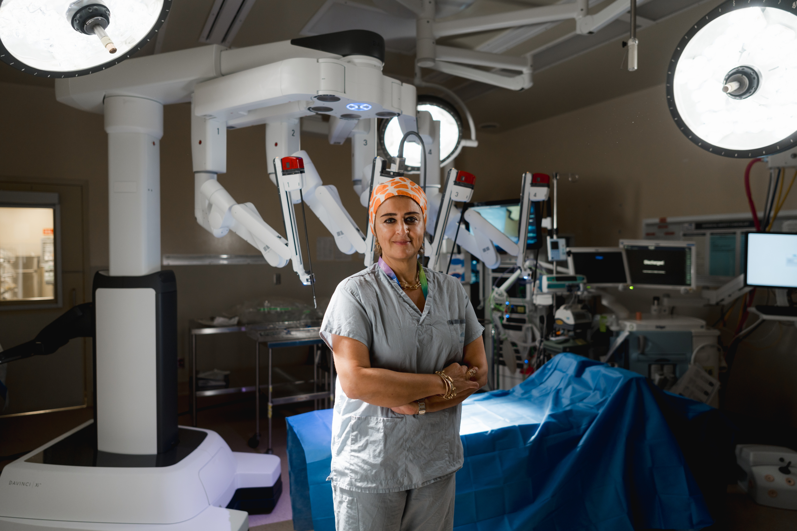 Dr. Mona Mazgani in an operating room at Royal Jubilee Hospital with the da Vinci Surgical Robotics System.