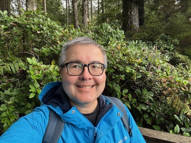 Matt Landers, patient porter, going on a hike on Vancouver Island